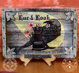 The Rue & Rook metal sign